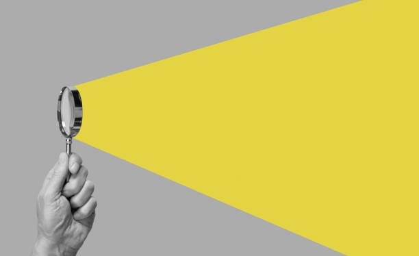 magnifying glass with yellow light Detective to Find Someone