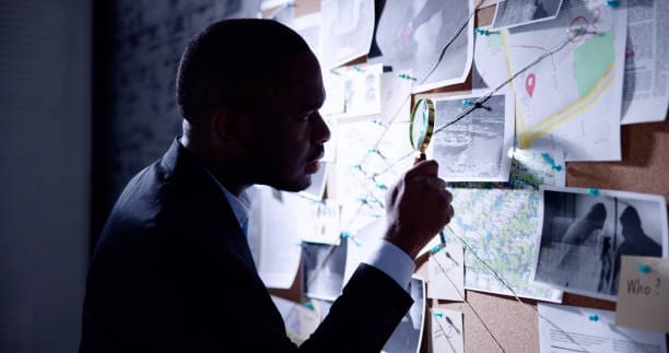 man looking at evidence Personal Investigator Near Me